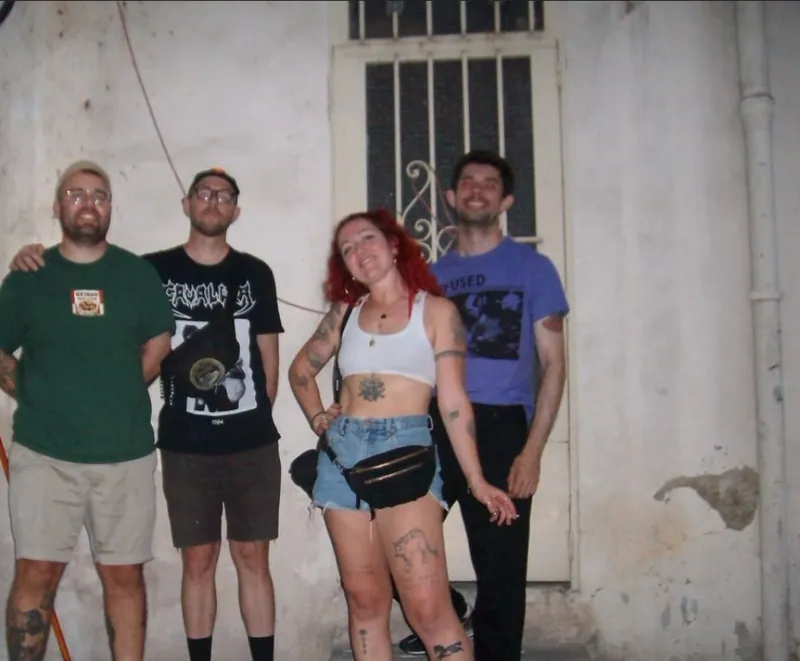 Band photo on tour in a courtyard